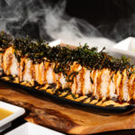 Kingdom Sushi Alice Roll - Salmon, spicy mayo, eel sauce, fried kale